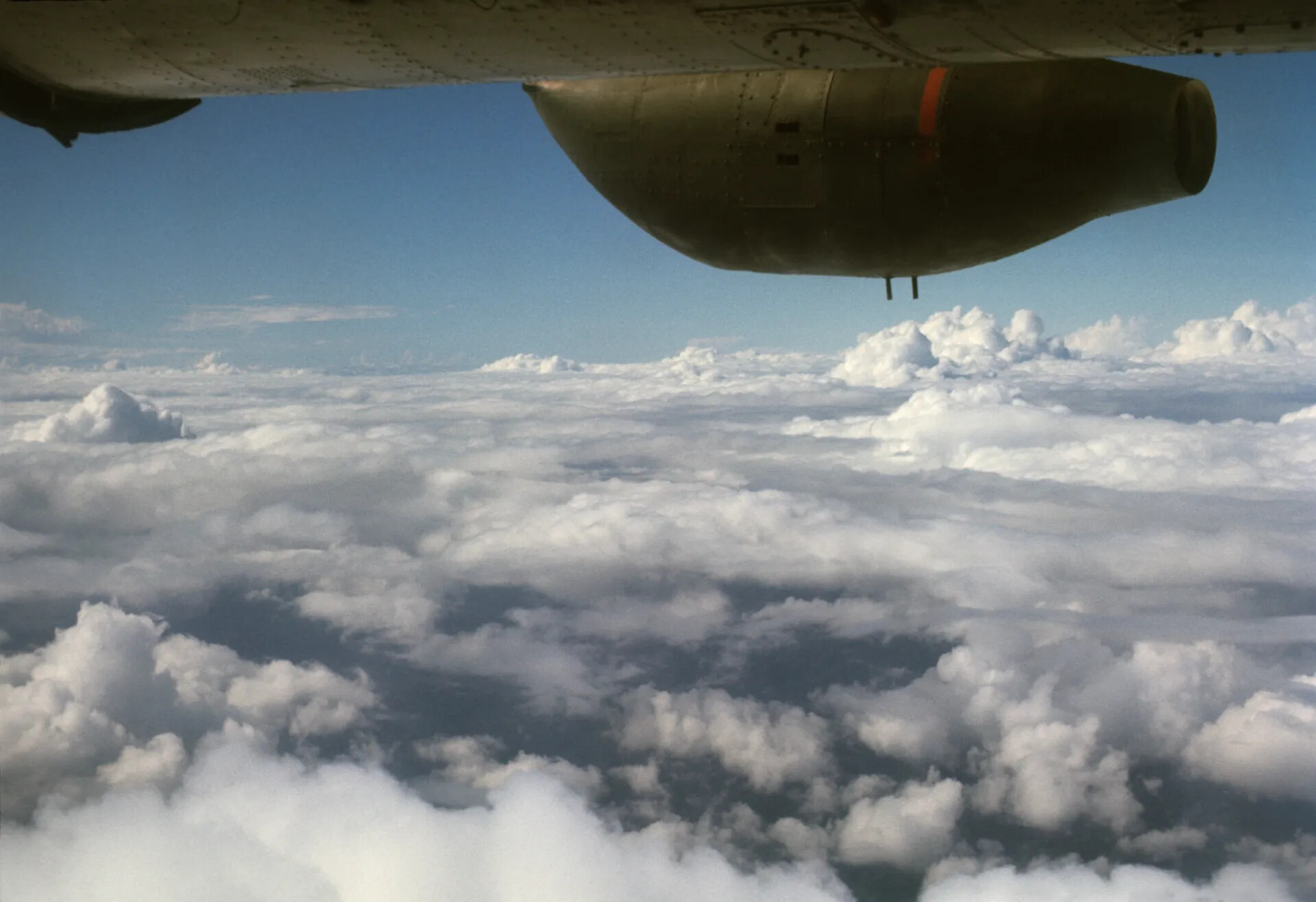 In-Flight View of Radial Engine Nacelle Above Cloud Layer, Southeast Asia