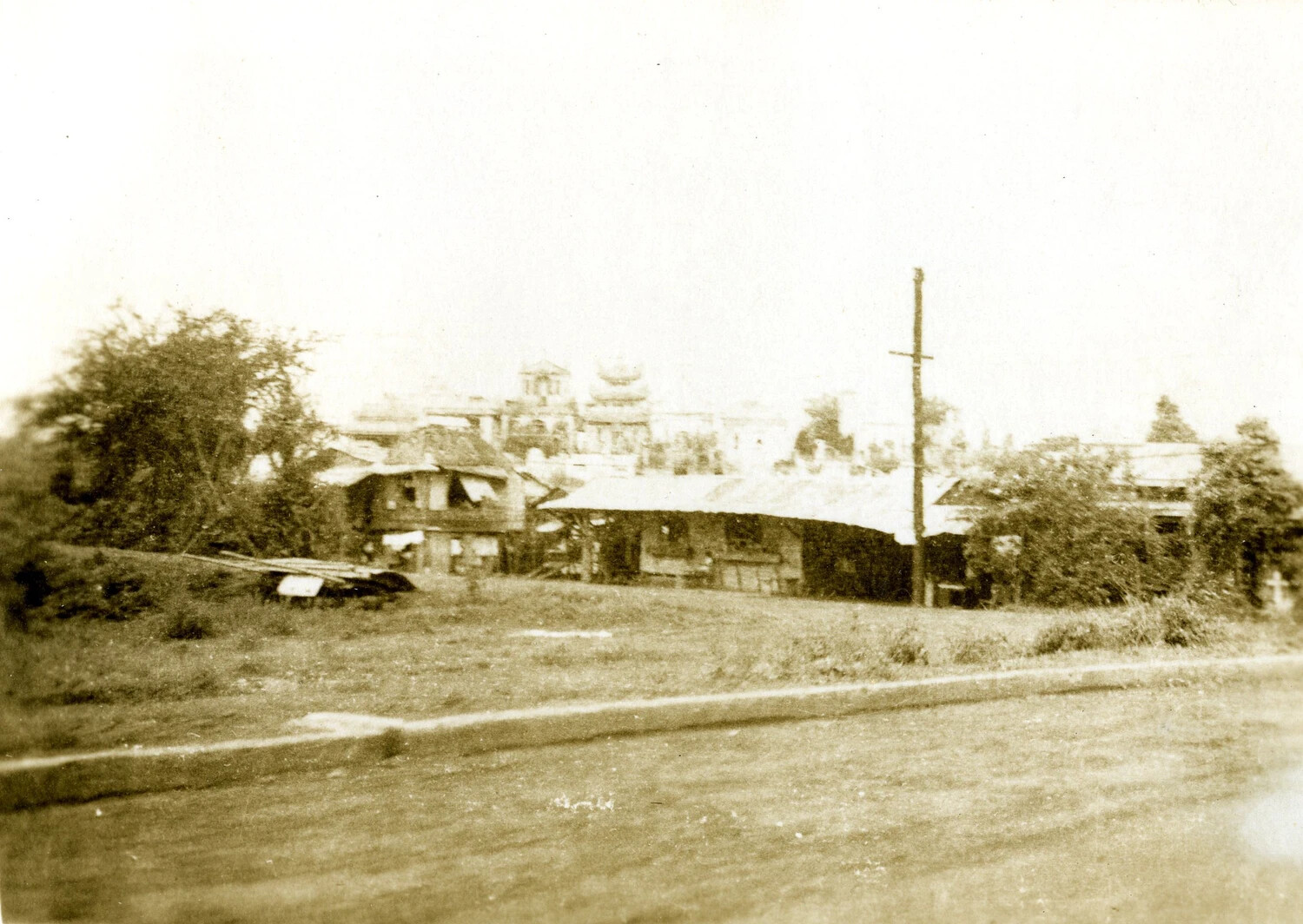 Village Structures and Distant Pagoda-Style Roofline, Ie Shima/Okinawa Area, WWII Pacific Theater