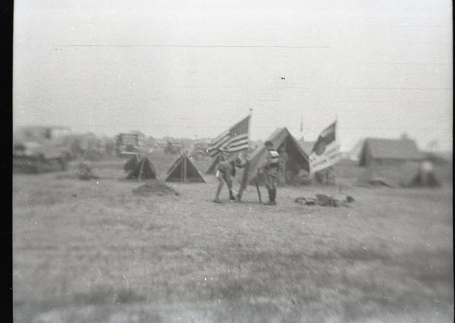 Youths Carrying American Flag at Tent Encampment, State-Side, WWII Era