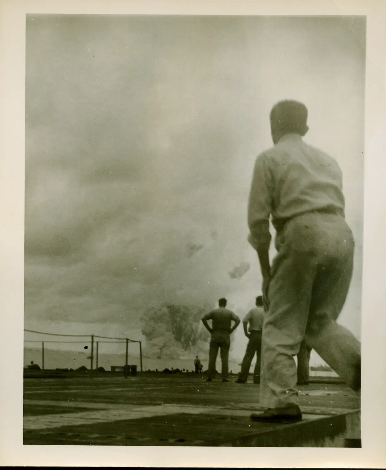 Sailors Observing Explosion or Smoke Plume from Carrier Flight Deck, USS Petrof Bay (CVE-80)