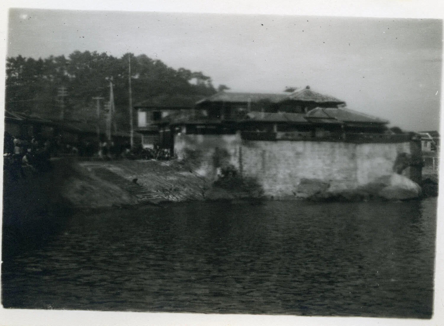 Waterfront View of Japanese Coastal Village with Stone Seawall, Occupied Japan, circa 1945-1946