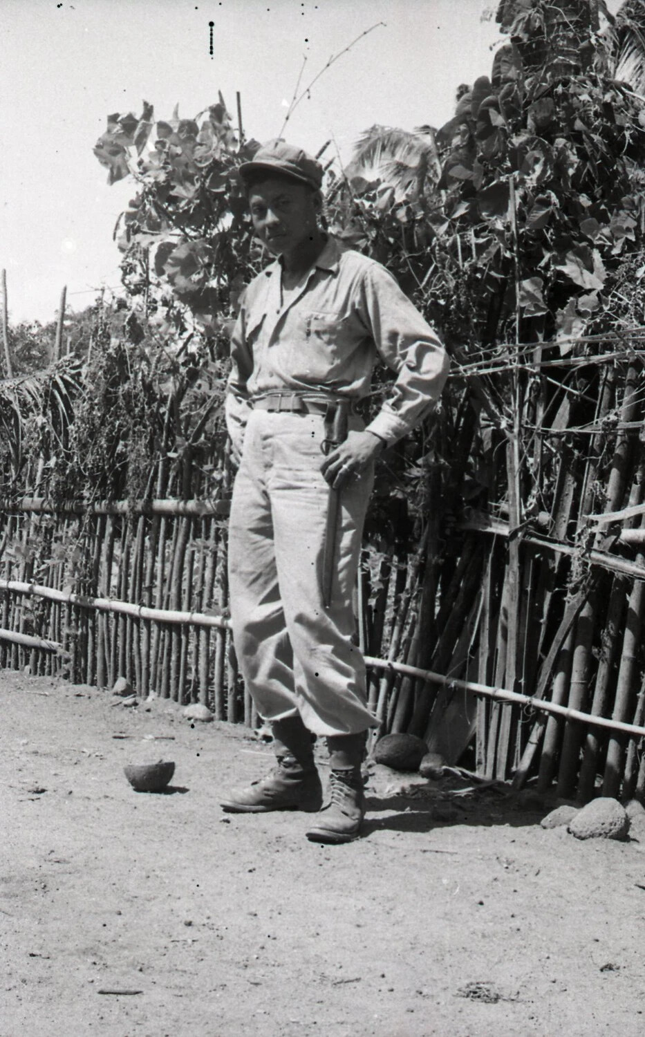 Portrait of a Man with Bolo Knife Beside a Bamboo Fence, Luzon, Philippines, WWII