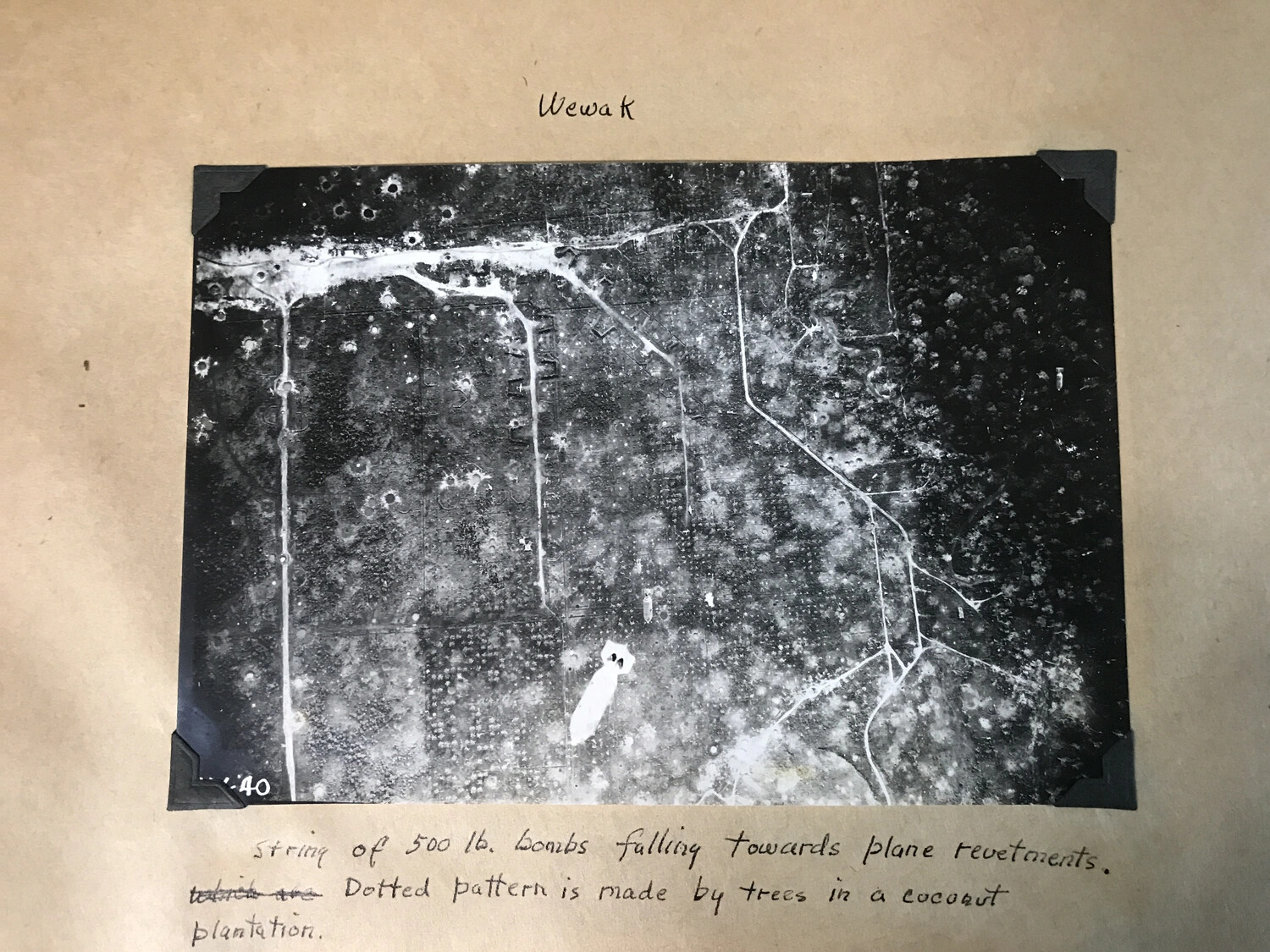 Wewak — Annotated Vertical Photograph of a Bomb String Falling on Aircraft Revetments