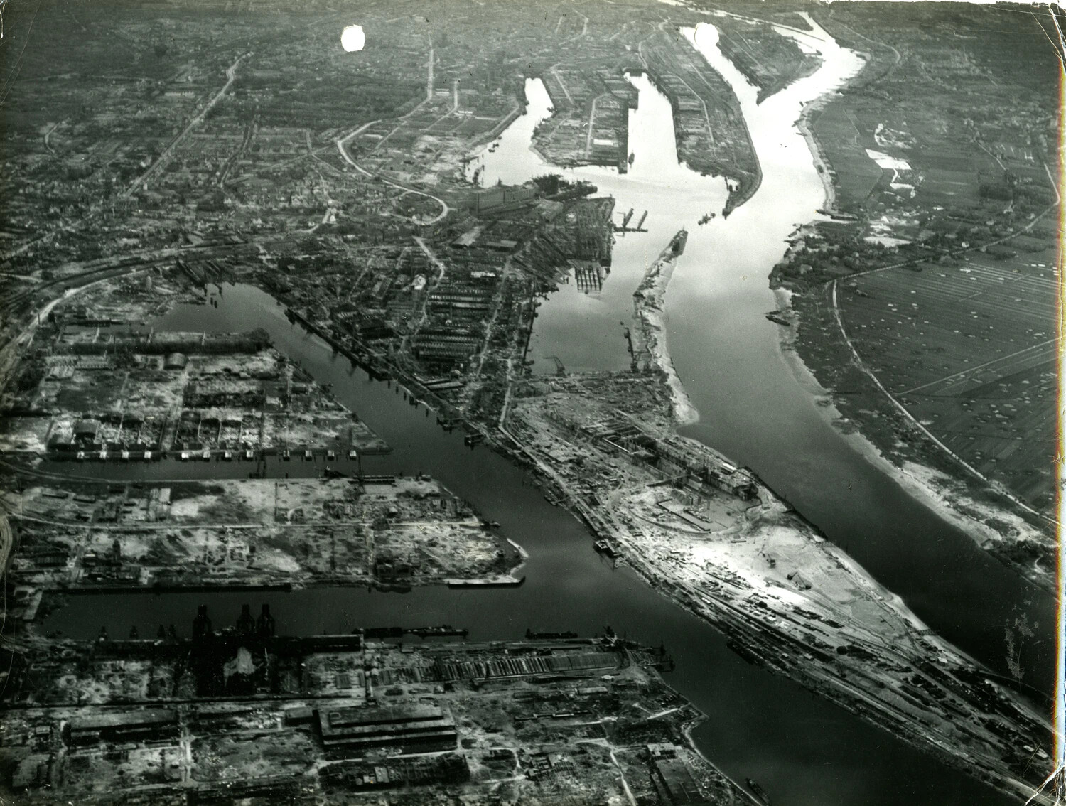 Aerial View of a War-Damaged European River Port and Industrial District, WWII European Theater