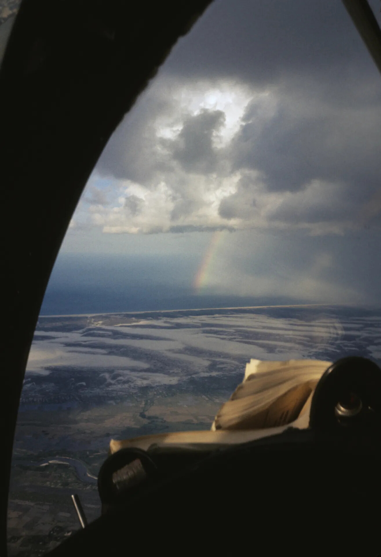 In-Flight Cockpit View with Rainbow Over Coastal Vietnam, Vietnam War Era (Alternate Frame)