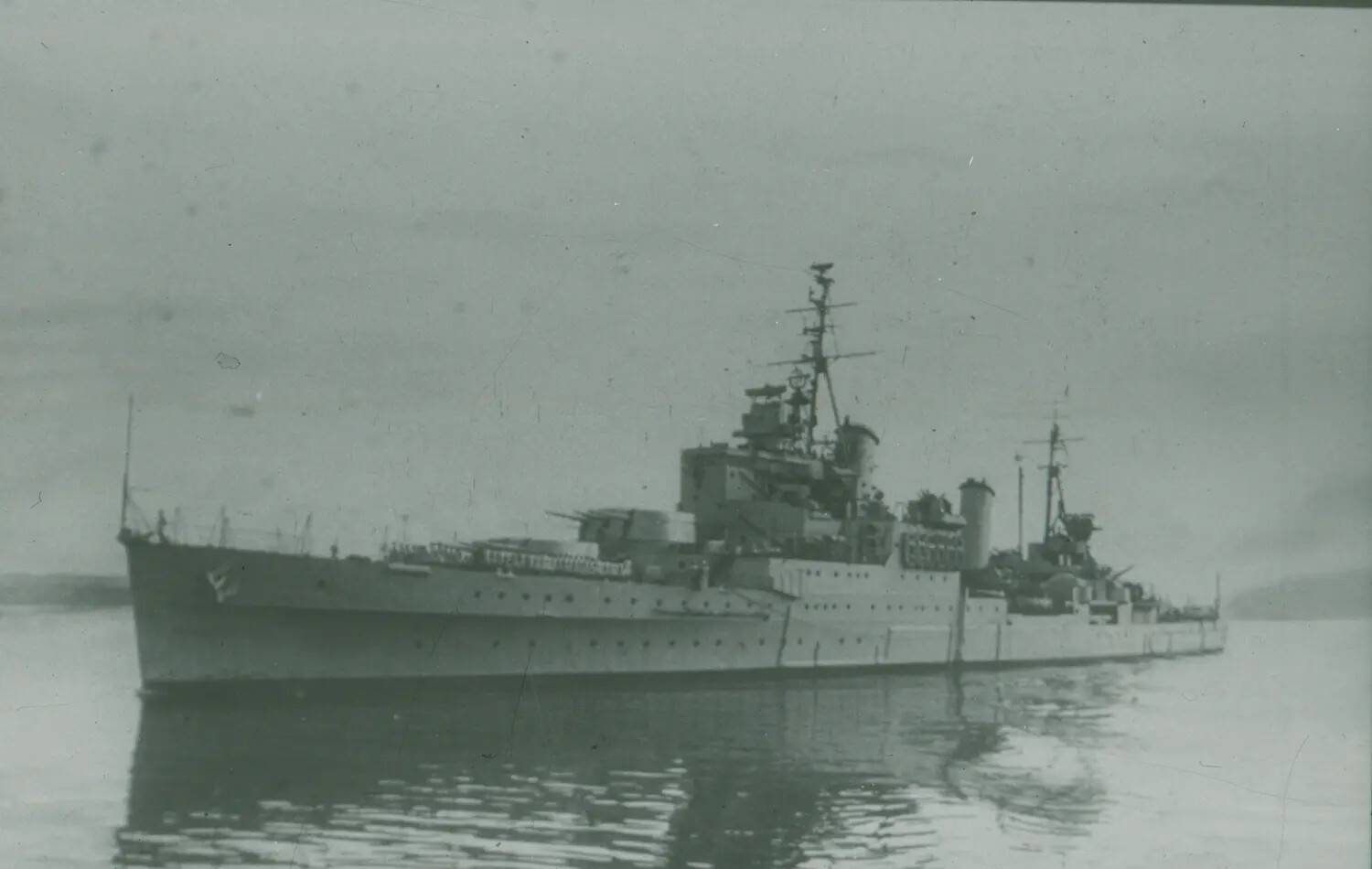 British Royal Navy Cruiser at Anchor, World War II