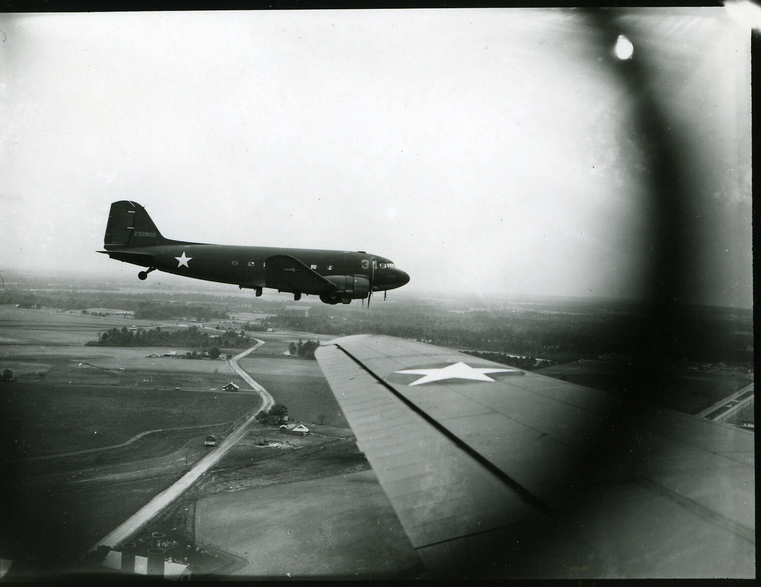 C-47 Skytrain in Formation, Photographed from a Sister Aircraft's Wing