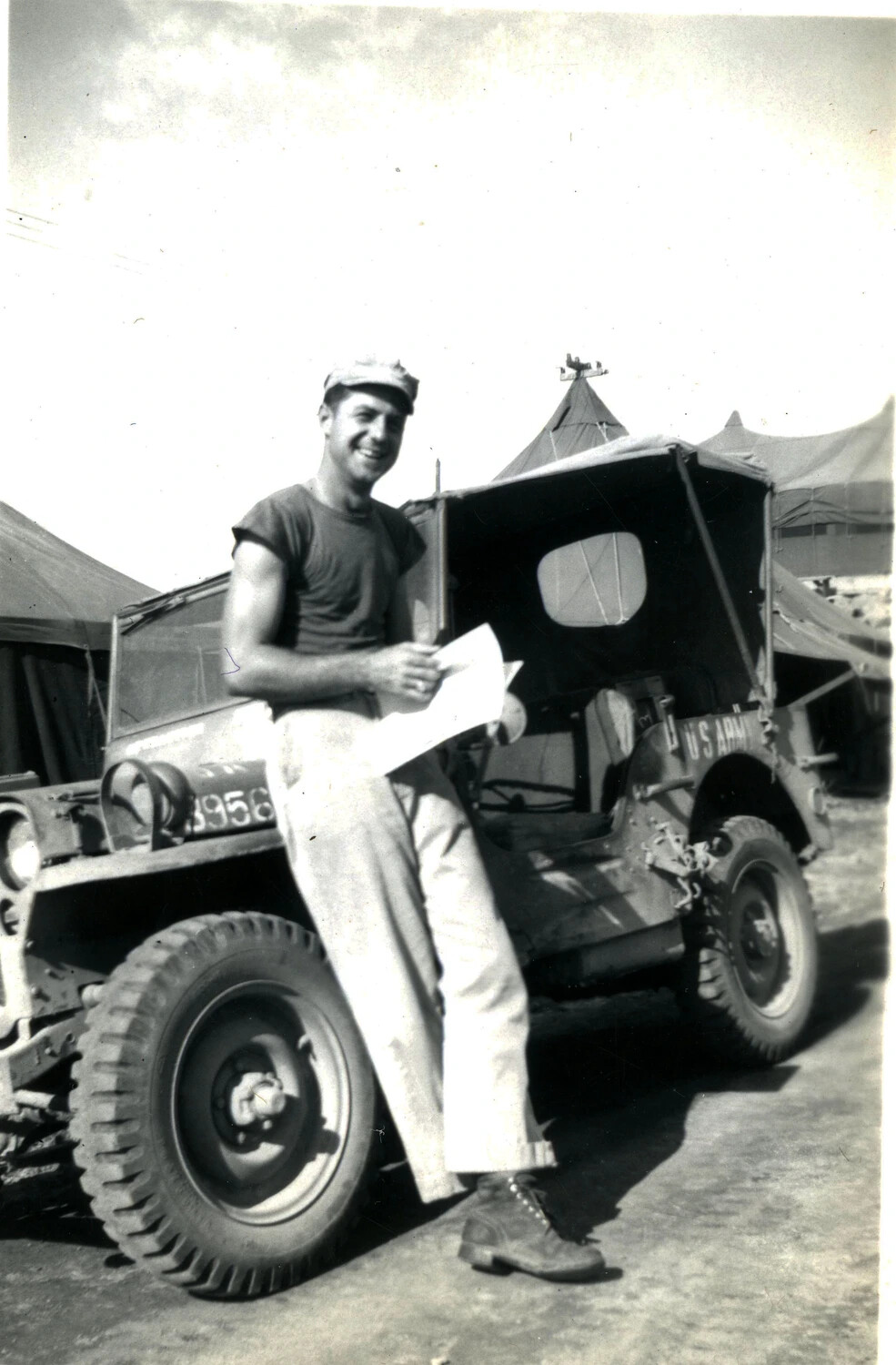 U.S. Serviceman with U.S. Army Jeep at Pacific Camp, WWII