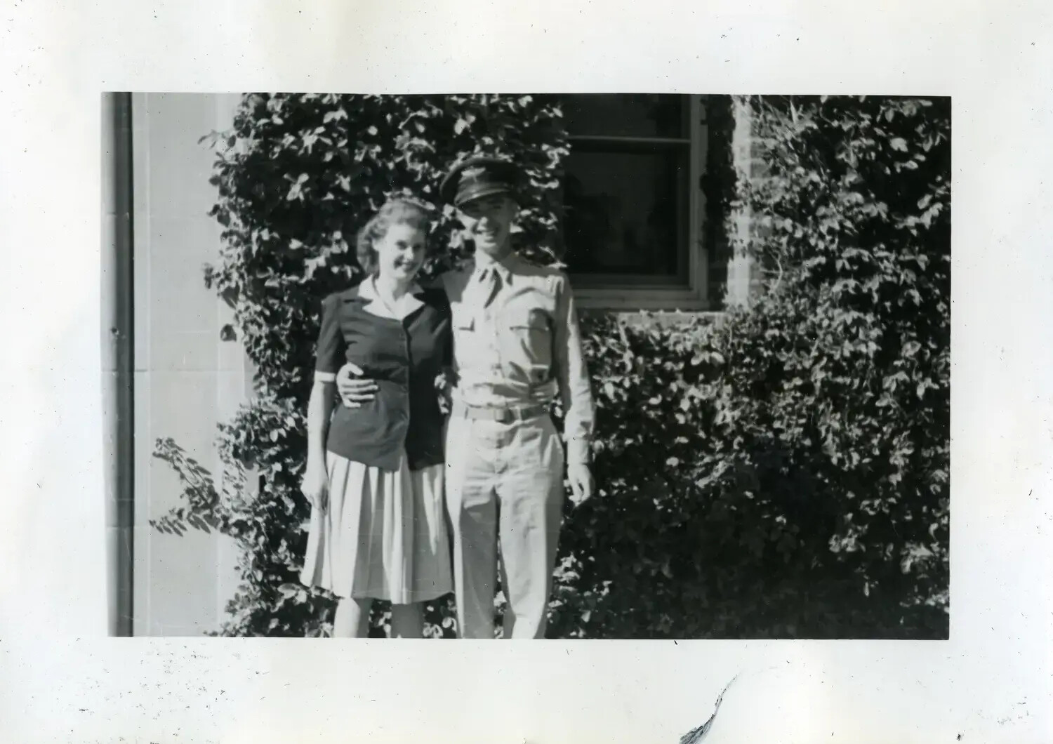 Sailor in Khaki Uniform with Companion, USS Maryland Photo Album, c. 1940