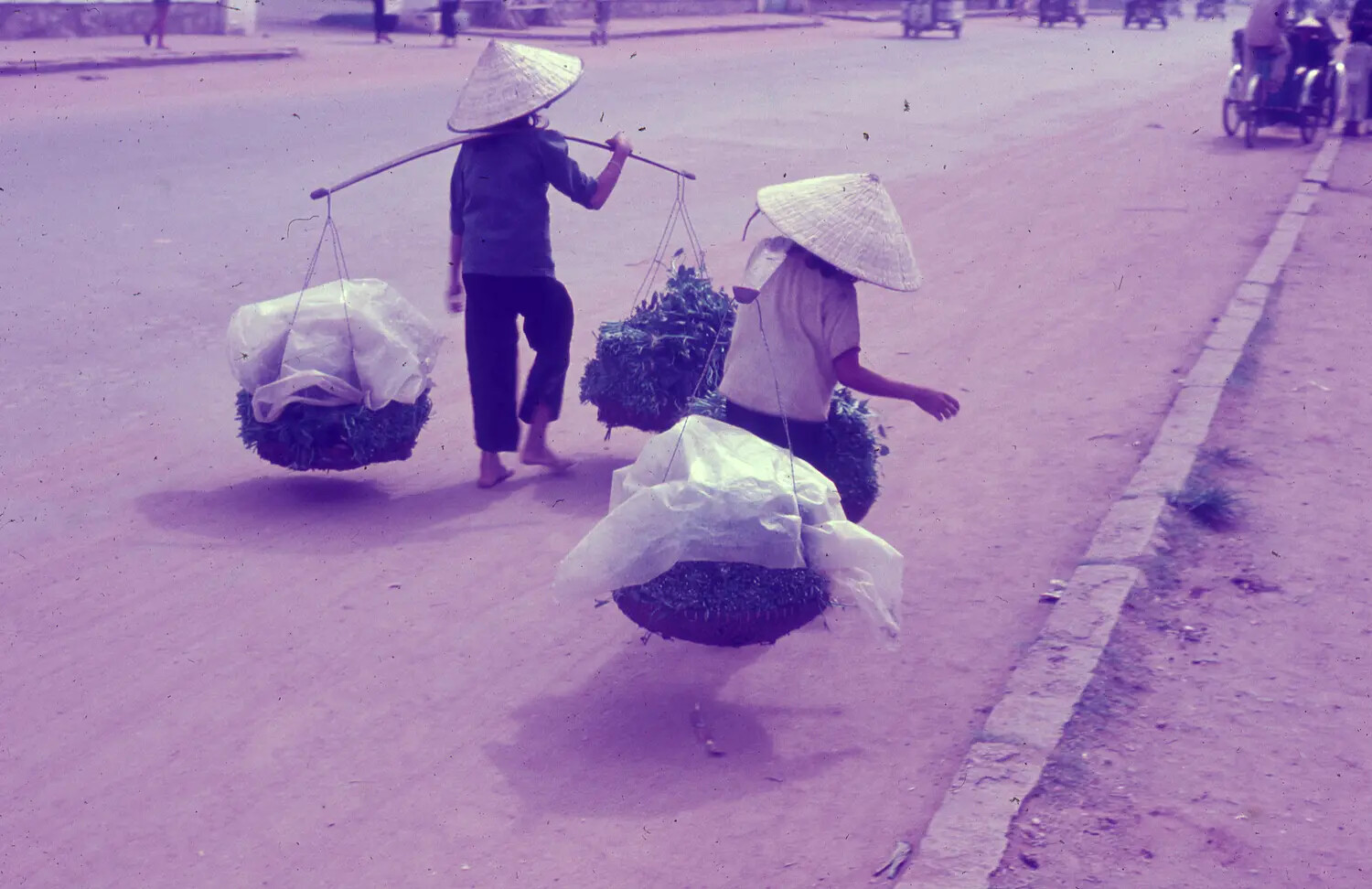 Vietnamese Women Carrying Yoke Baskets of Produce, South Vietnam, c. 1965