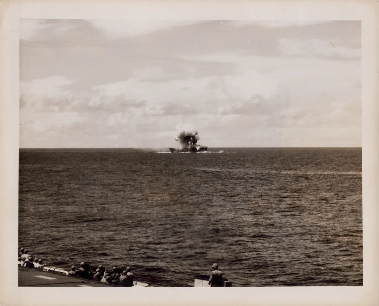 USS Suwannee (CVE-27) Burning After Kamikaze Crash-Dive on Flight Deck, Viewed from USS Petrof Bay (CVE-80), 26 October 1944