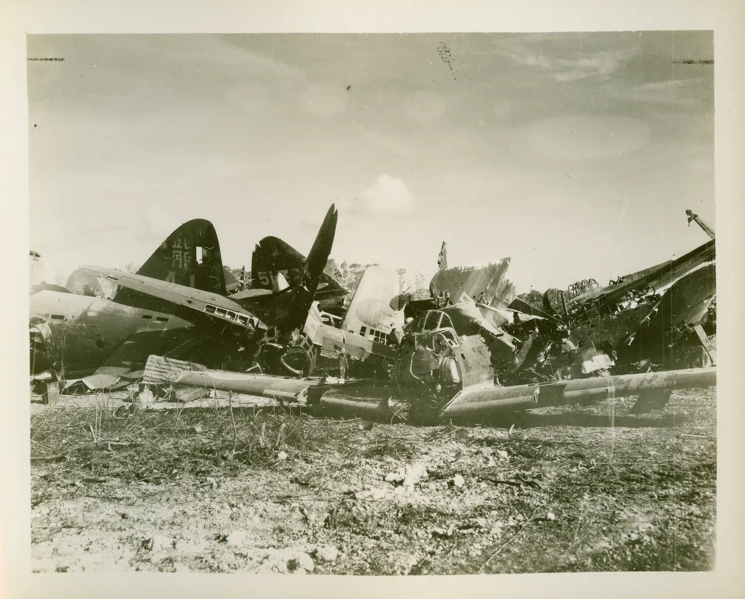 Wrecked Japanese Aircraft at Bombed Airfield, USS Petrof Bay (CVE-80) Collection, WWII