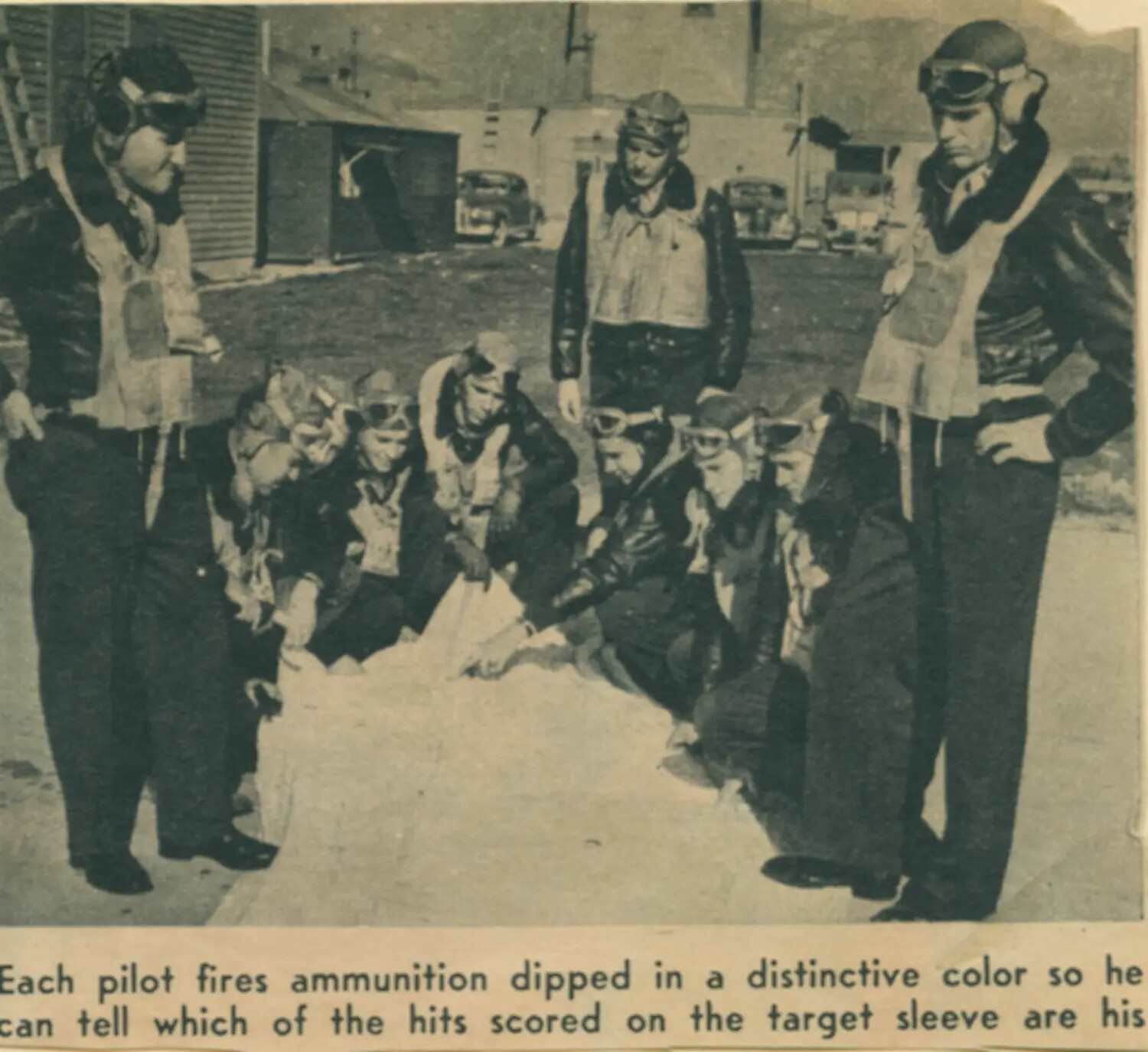 USAAF Fighter Pilots Examine Color-Coded Aerial Gunnery Target Sleeve, WWII Era