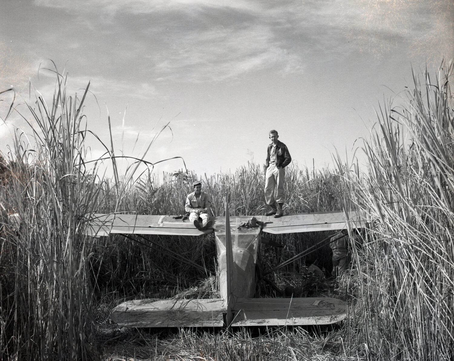 Crash-Landed Liaison Aircraft in Tall Grass with Airmen, CBI Theater — 'The Body,' Kotec Collection