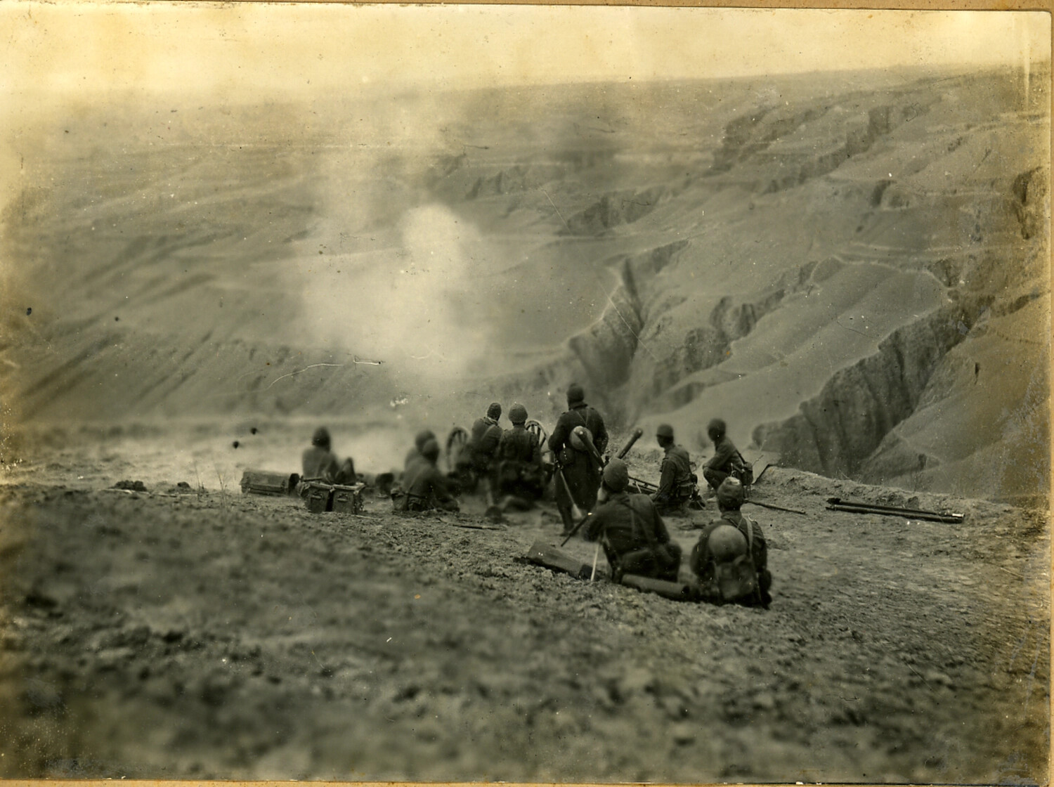 Japanese Army Mountain Gun Crew Firing from a Ravine Position, North China