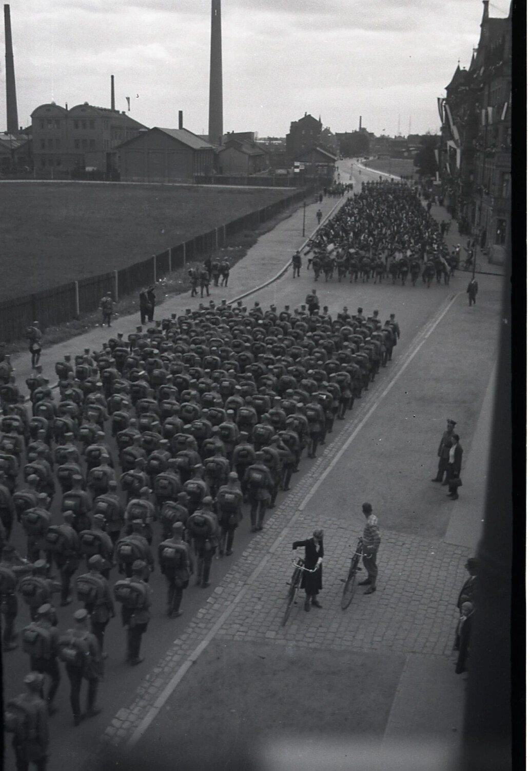 Wehrmacht Infantry Column on the March Through a German Industrial Town