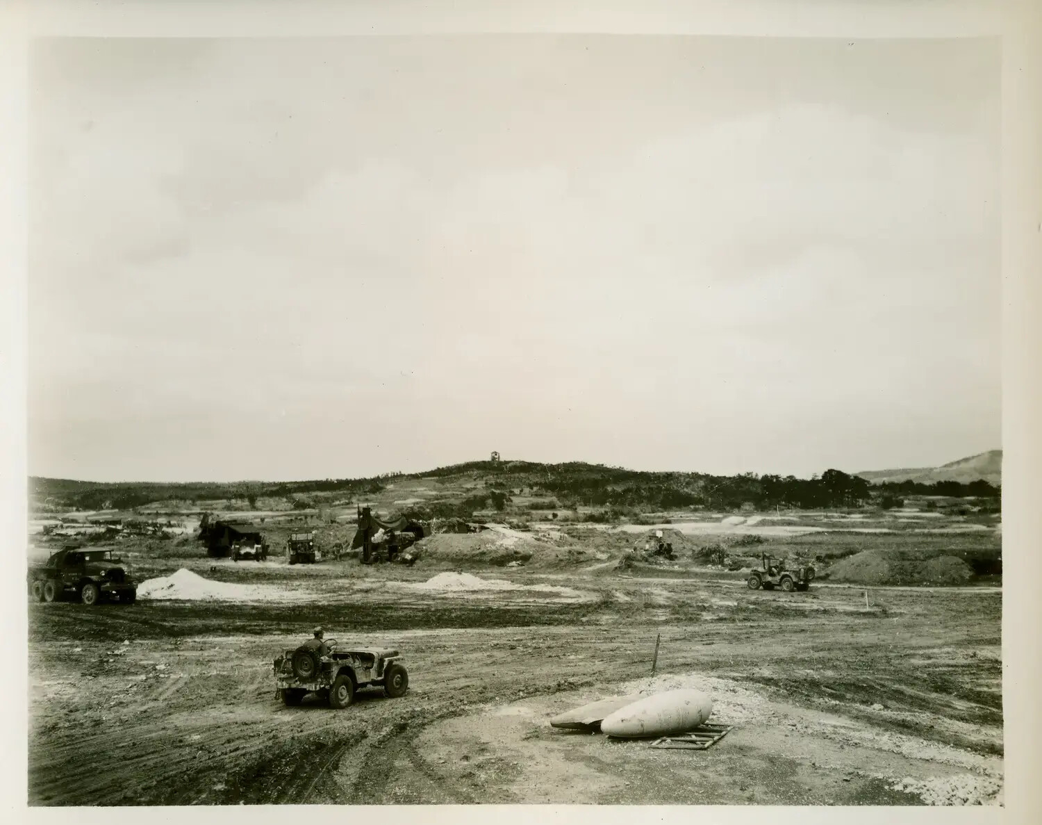 Airfield or Base Construction Site with Jeeps and Ordnance, Pacific Theater, WWII