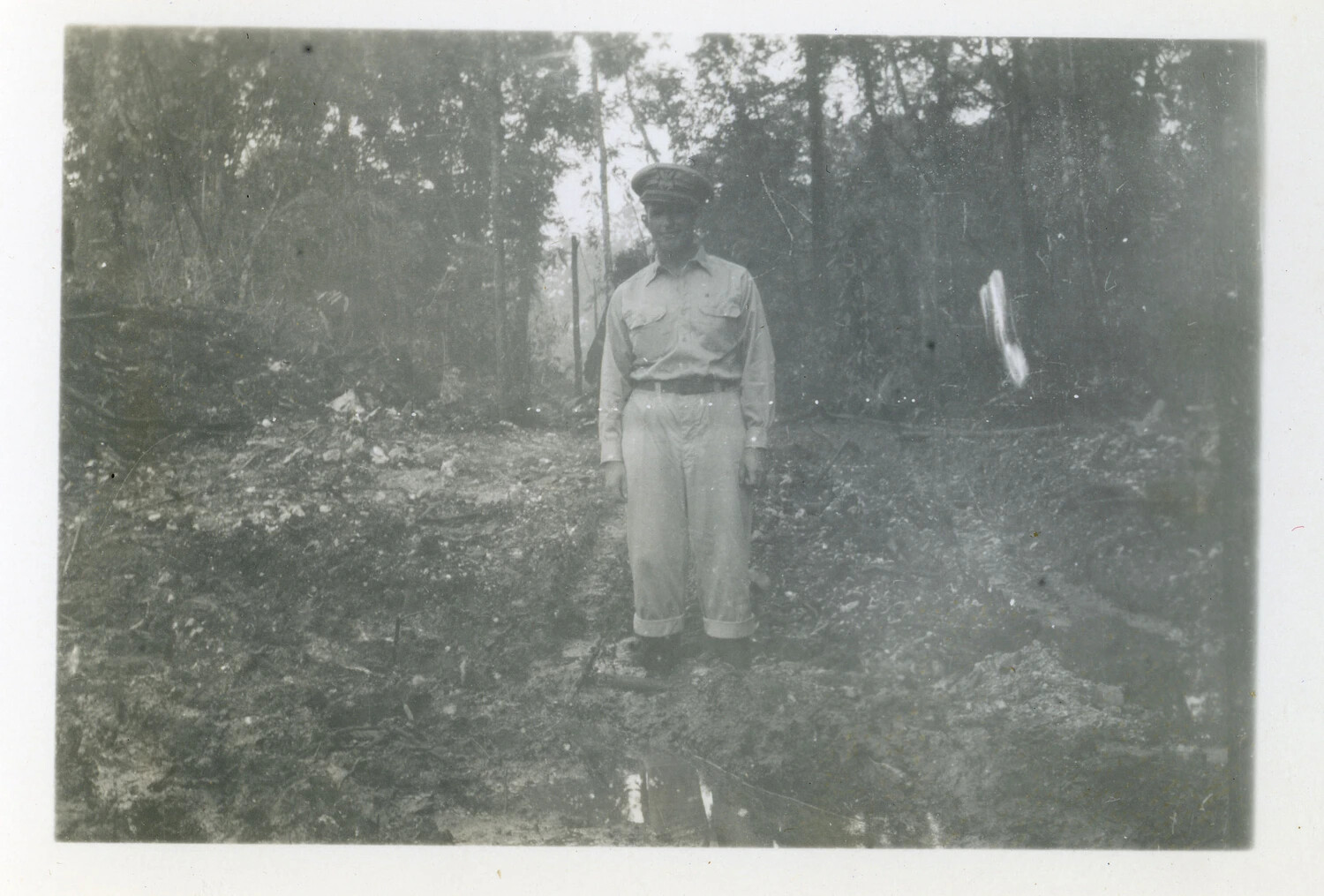 Officer Standing in Newly Cleared Jungle Ground at a Forward Pacific Base, World War II