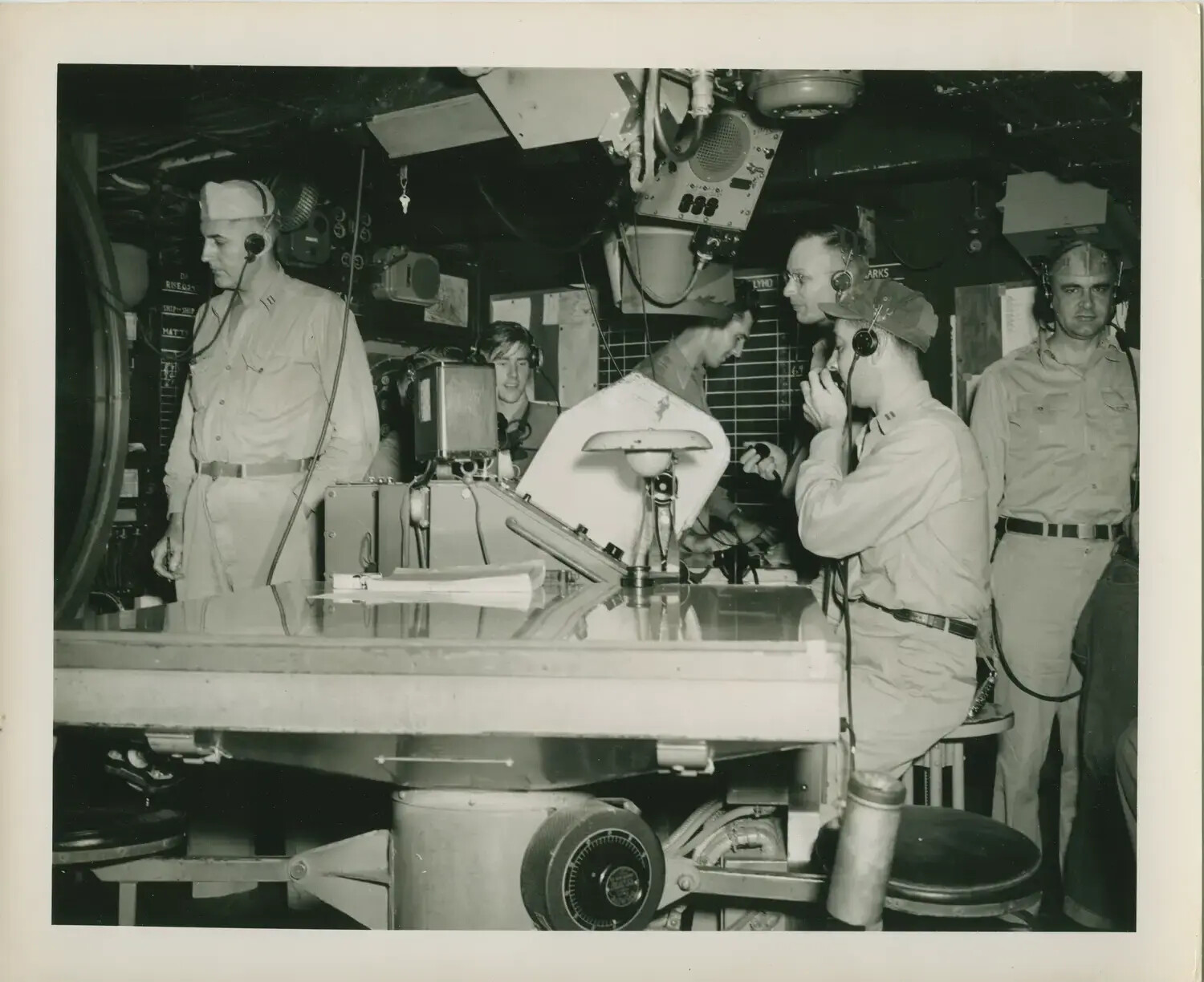 Sailors at the Plotting Table in the Combat Information Center, USS Petrof Bay (CVE-80), WWII