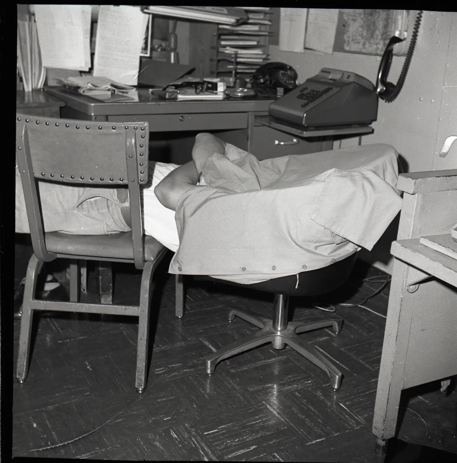 Sailor Napping in Shipboard Office, USS Ticonderoga (CVA/CVS-14), Vietnam War Era