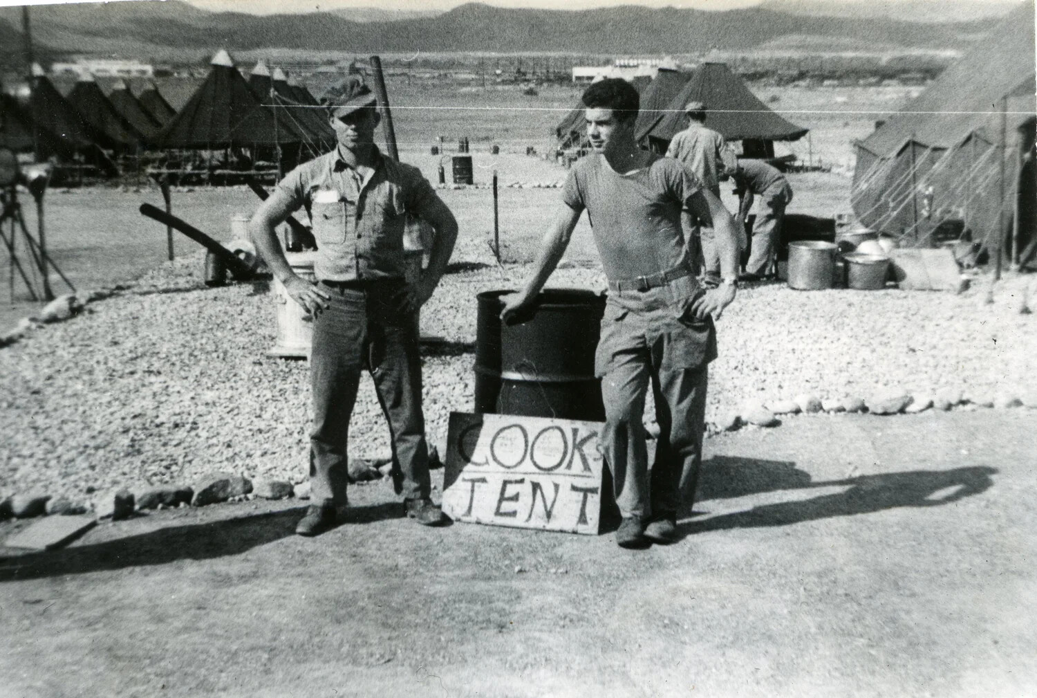 Marines Posing at the 'Cook's Tent' Sign, VMF-214 Squadron Camp, 1945