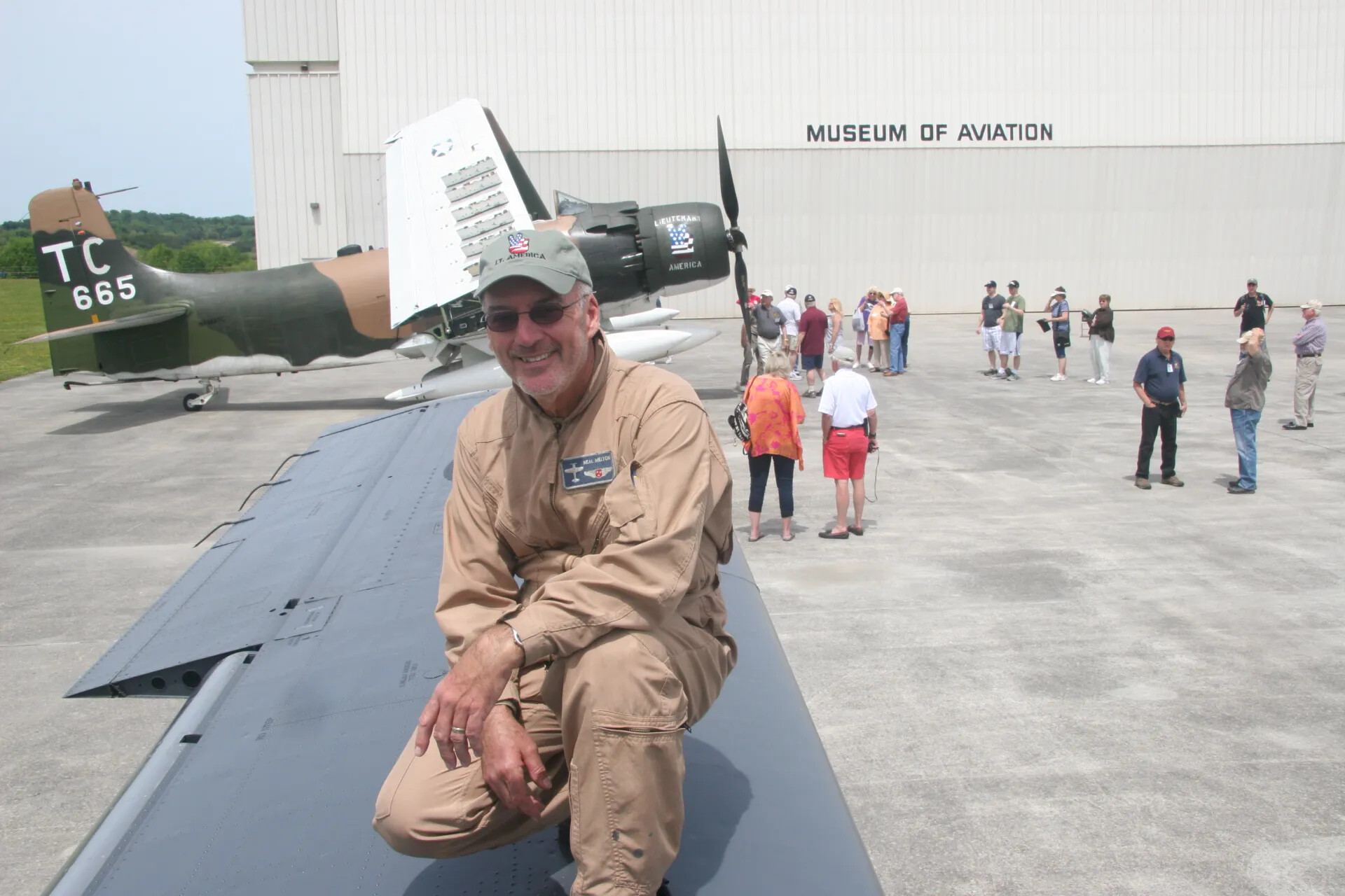 Neal Melton Poses with A-1 Skyraider 'Lieutenant America,' Museum of Aviation, 2016