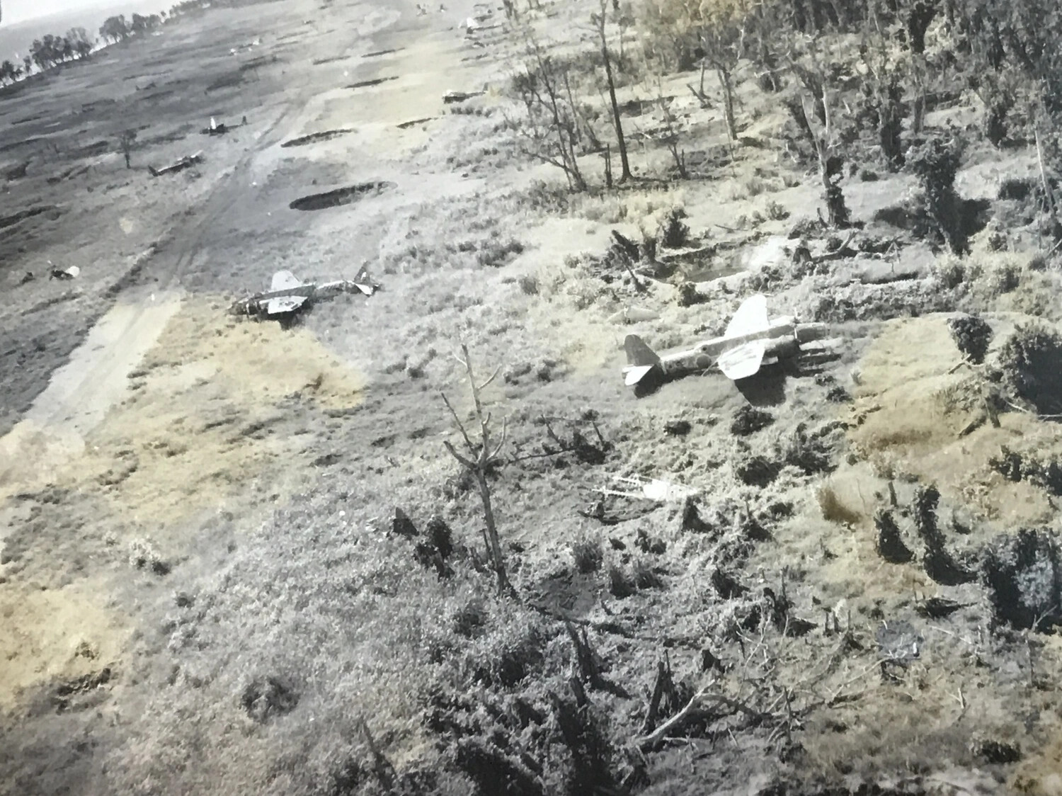 Low-Level Strike Photo: Destroyed Japanese Aircraft at Wewak Airfield, New Guinea
