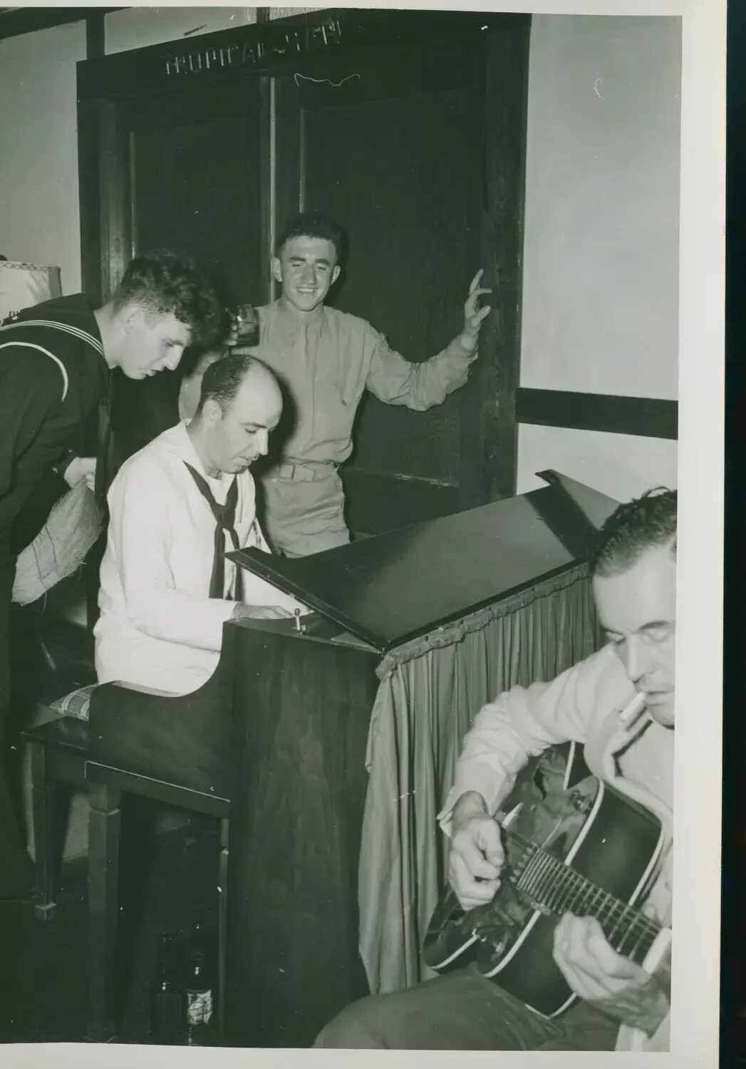 Sailors and Soldier Making Music at Shipboard Recreation Club, USS Petrof Bay (CVE-80), WWII