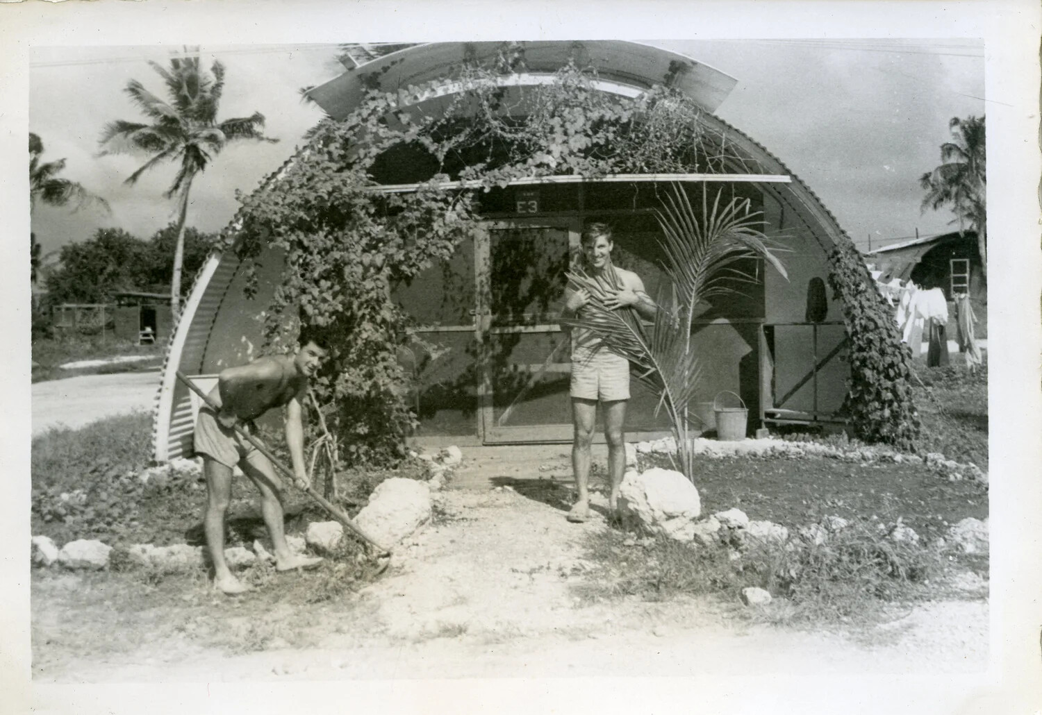 Sailors at Their Vine-Covered Quonset Hut Barracks, "E3" — NAS Agana, Guam