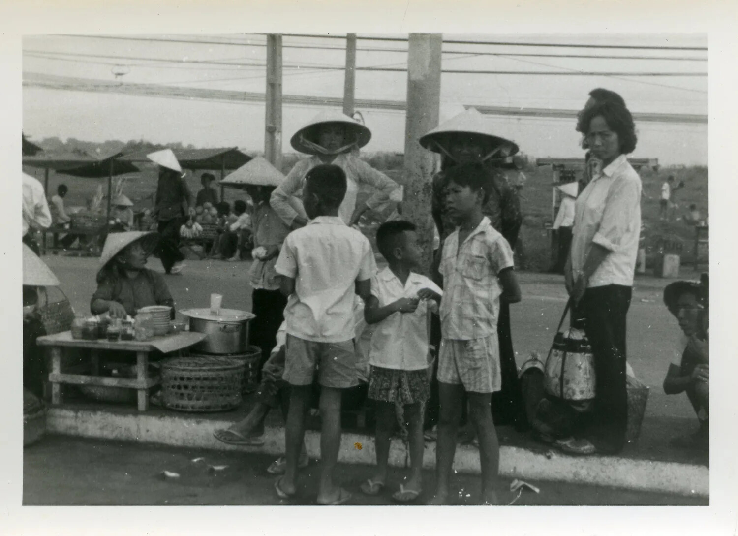 Roadside Vendor and Civilians at Market Curb, South Vietnam, 1967