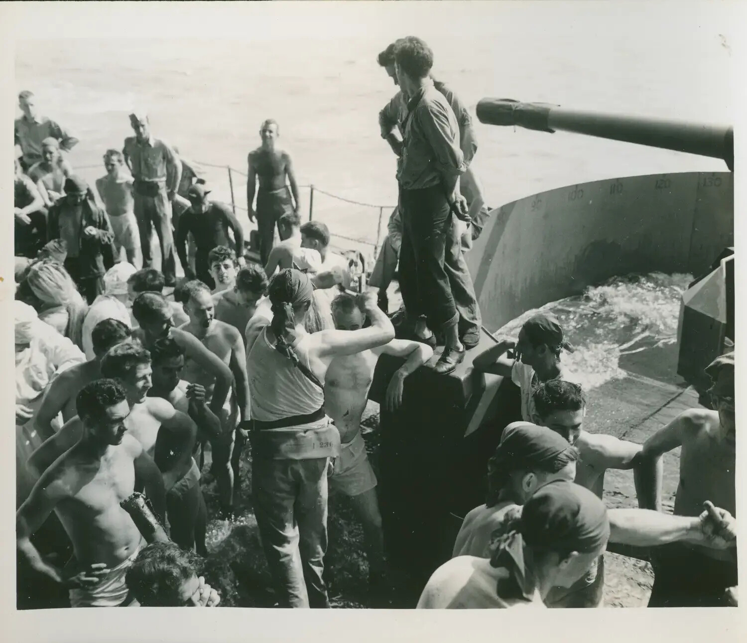 Sailors Gathered for Swim Call Near the Gun Mount, USS Petrof Bay (CVE-80), WWII Pacific Theater