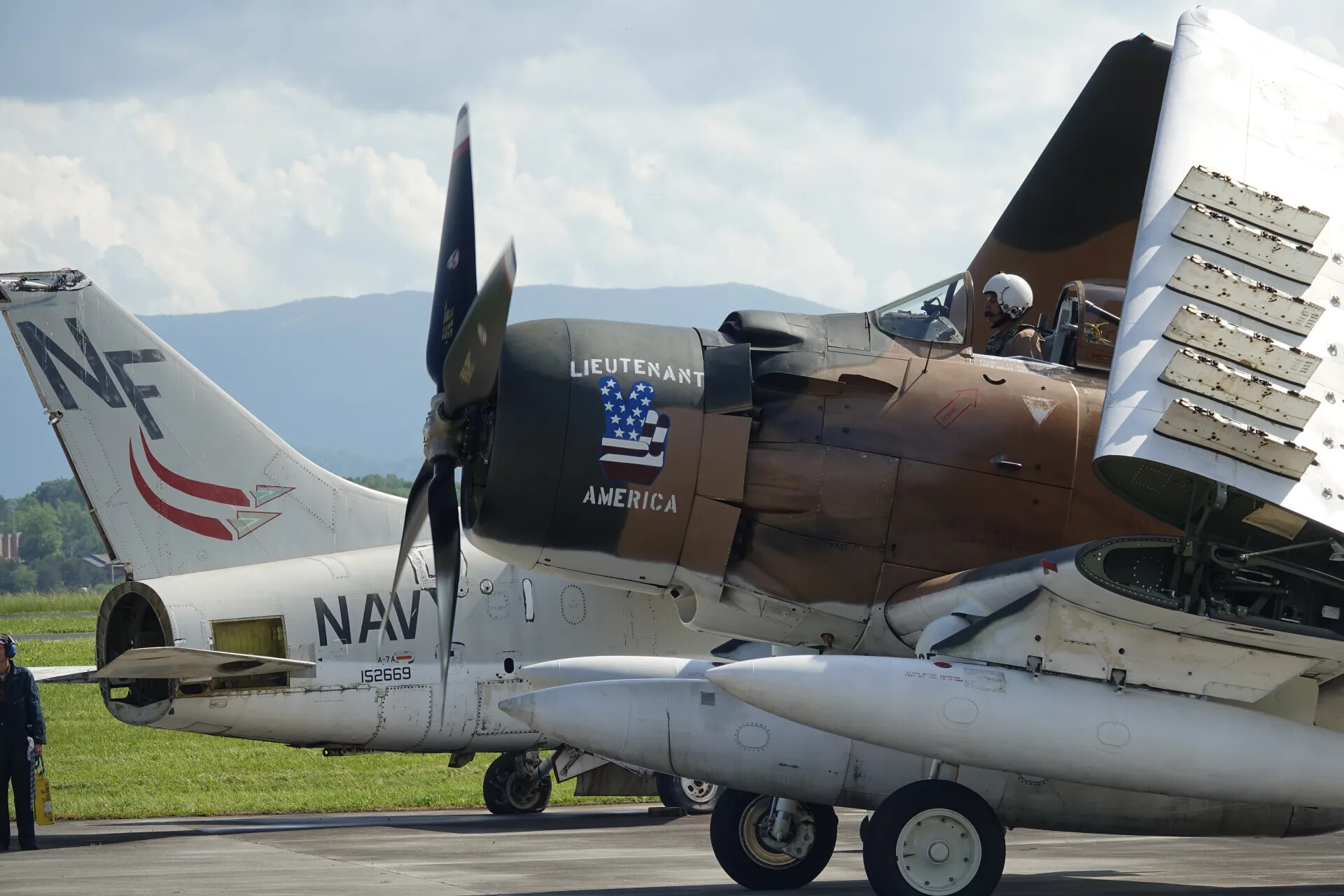 A-1 Skyraider 'Lieutenant America' Beside U.S. Navy A-7A Corsair II Tail Section (BuNo 152669)