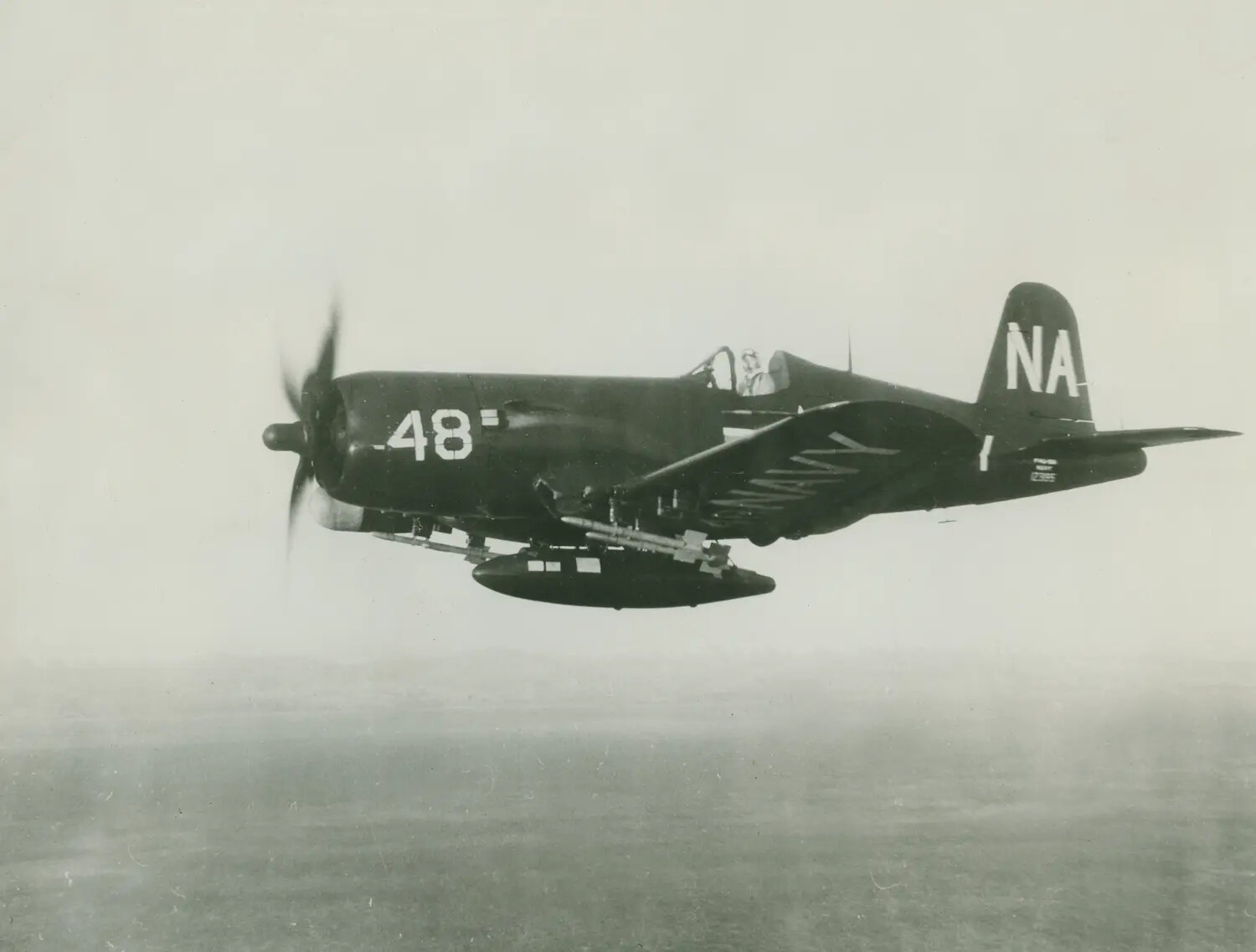 U.S. Navy Vought F4U Corsair (Side No. 48, Tail Code 'NA') in Flight with Underwing Rockets, Korean War Era