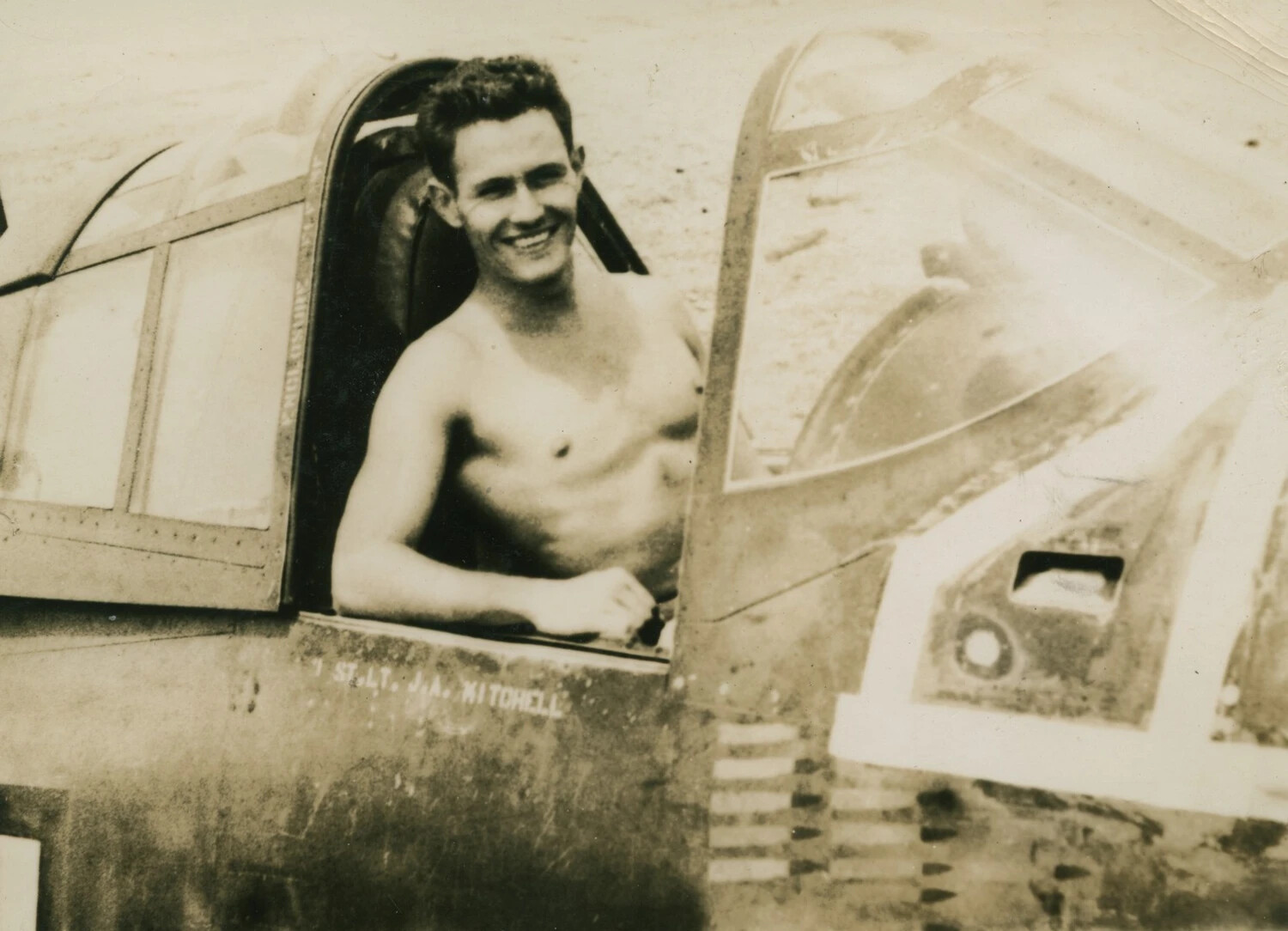Fighter Pilot 1st Lt. J.A. Mitchell in Cockpit with Exposed Wing Armament, World War II
