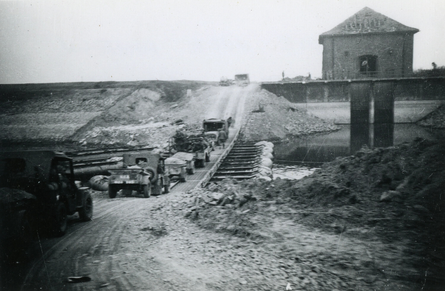 Military Convoy Crossing Engineer-Built Timber Bridge Over Canal, WWII