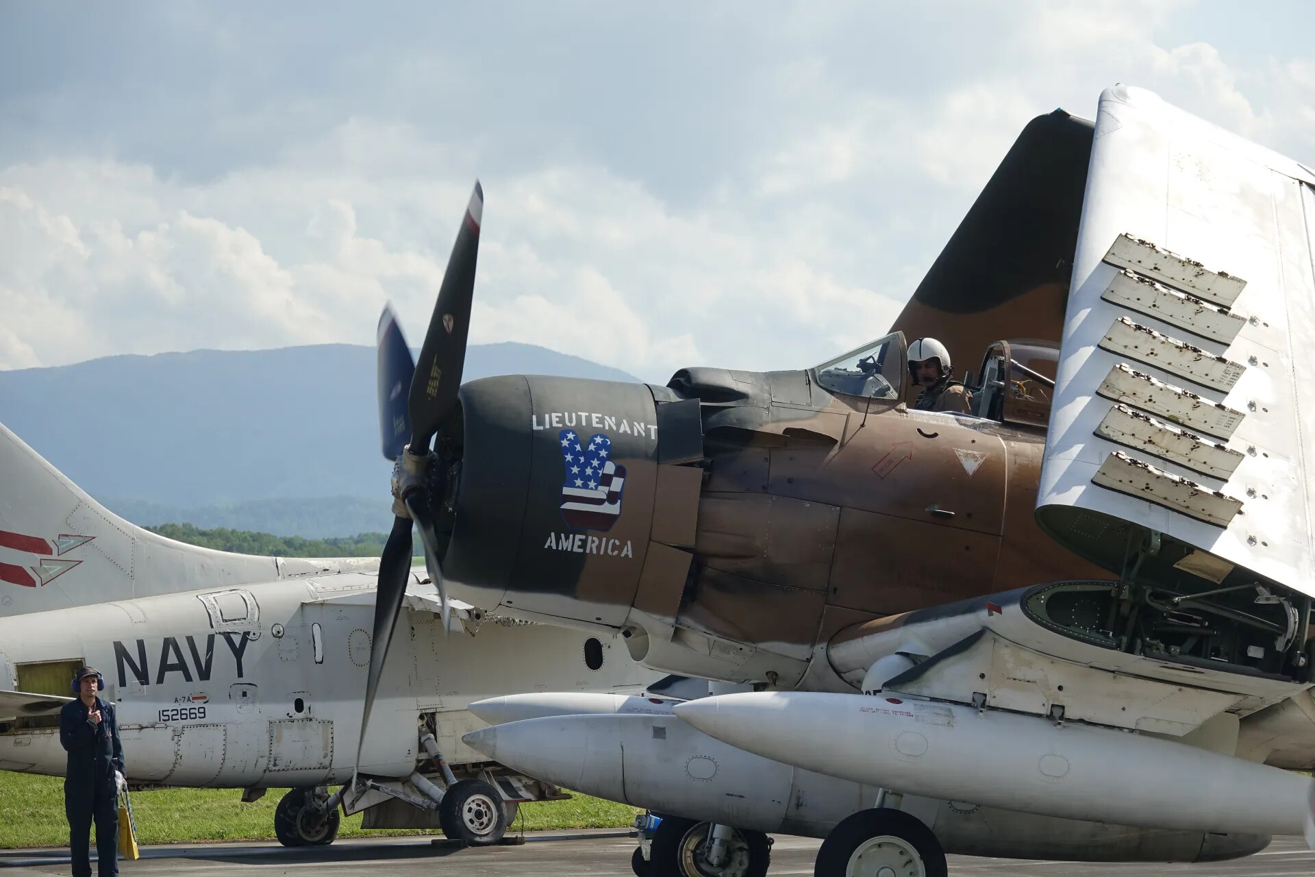 A-1 Skyraider 'Lieutenant America' Parked Beside Navy A-7A Corsair II BuNo 152669