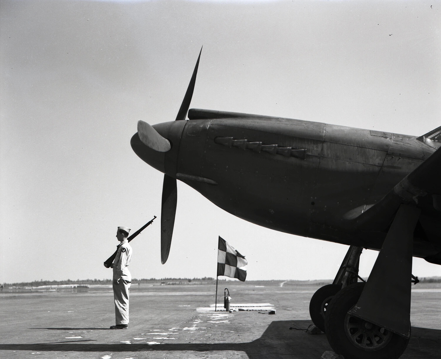 Armed Sentry Guarding a Parked Fighter Aircraft, China-Burma-India Theater, WWII