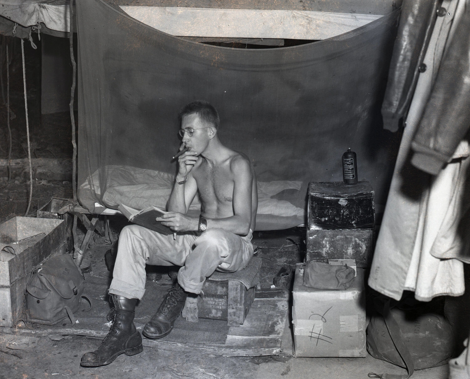 Off-Duty GI Reading and Smoking a Cigar in Tent Quarters, China-Burma-India Theater, WWII
