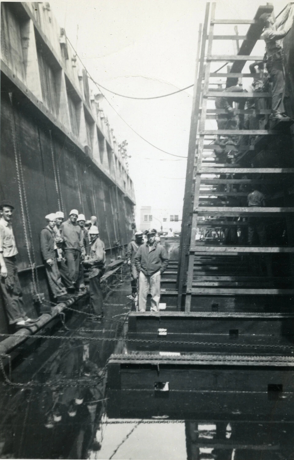 Submarine Crew and Shipyard Workers in Dry Dock, WWII Era
