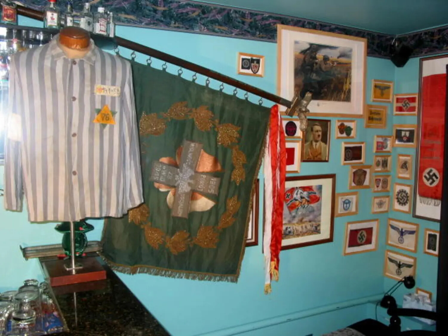 Private Collection Display of WWII German Militaria, Including a Concentration Camp Prisoner Uniform and Third Reich Memorabilia (Modern Photograph of Historical Artifacts)