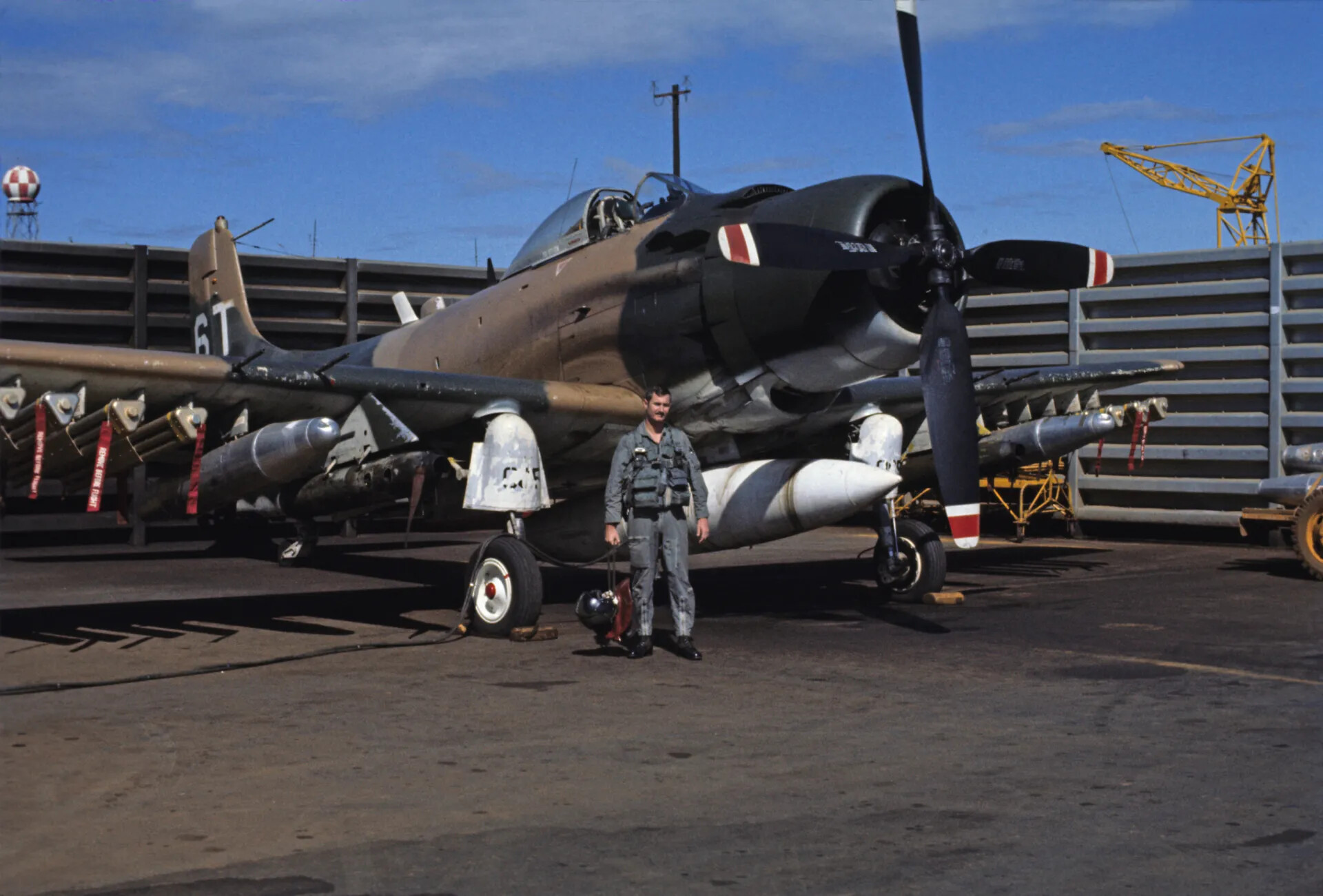 Armed Douglas A-1 Skyraider with Pilot on Ramp, Southeast Asia, circa 1969
