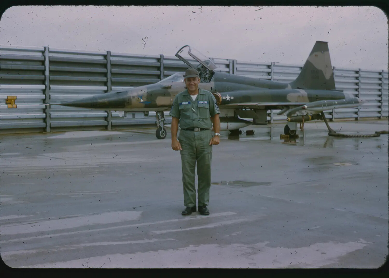 USAF Airman Posing with Camouflaged Northrop F-5A Freedom Fighter, Vietnam, 1965 (3rd Tactical Fighter Wing)