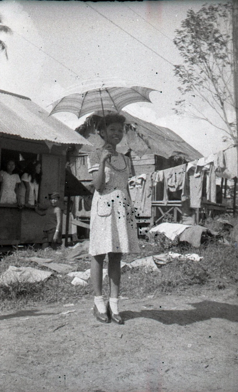 Filipina Girl with Parasol in Village, Luzon, Philippines, WWII Era