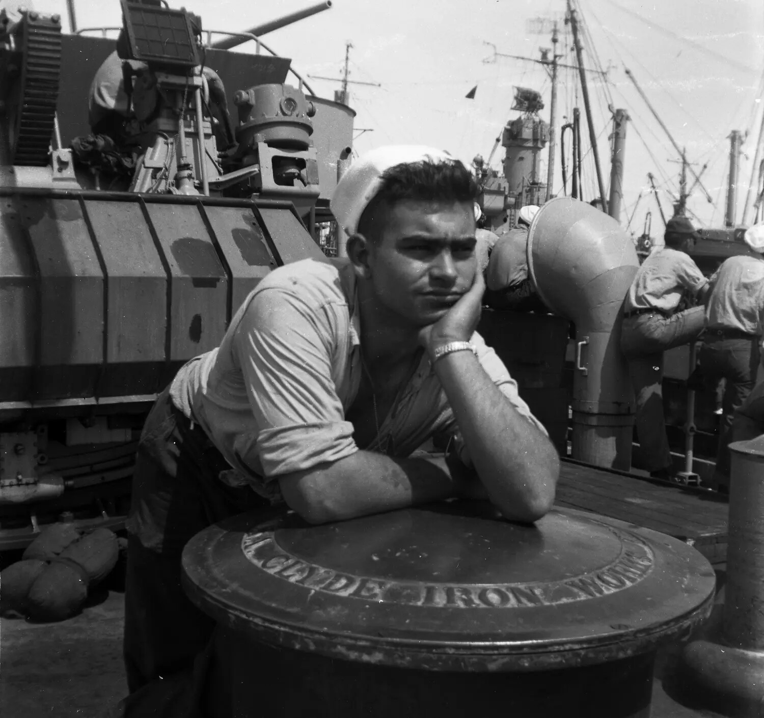 U.S. Navy Sailor Resting on Deck Capstan, Sasebo, Japan