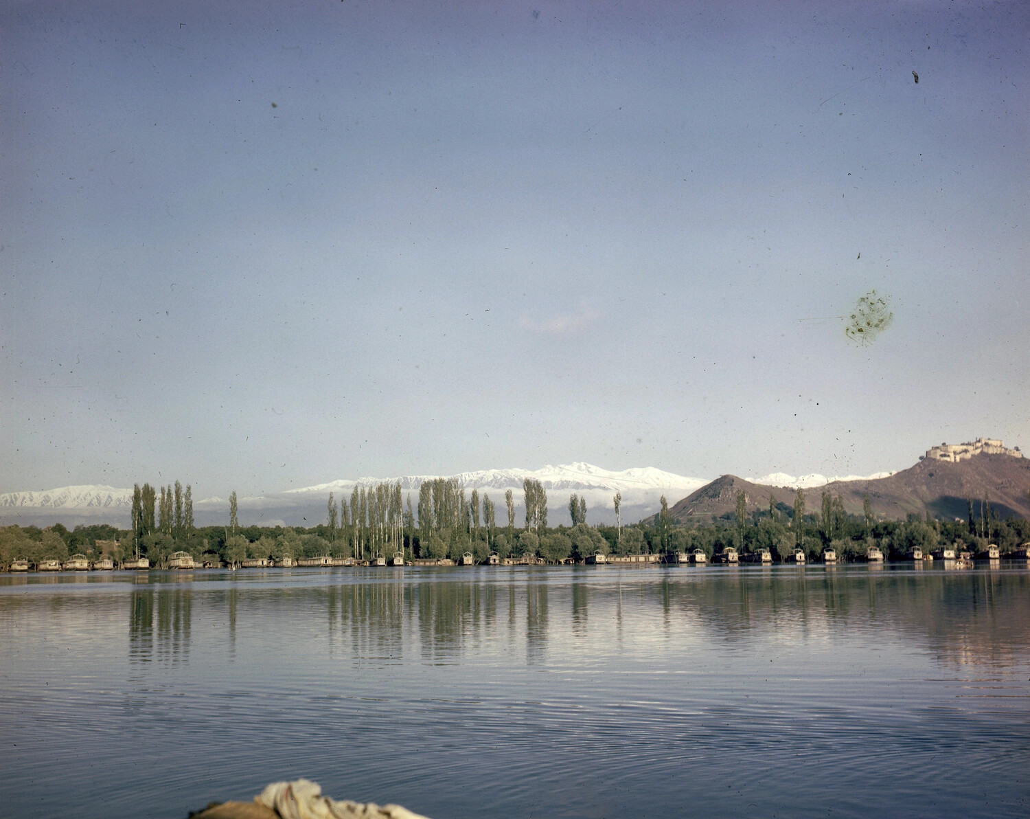 Lakeside View with Houseboats and Snow-Capped Mountains, Likely Dal Lake, Kashmir, India -- WWII Era Color Photograph