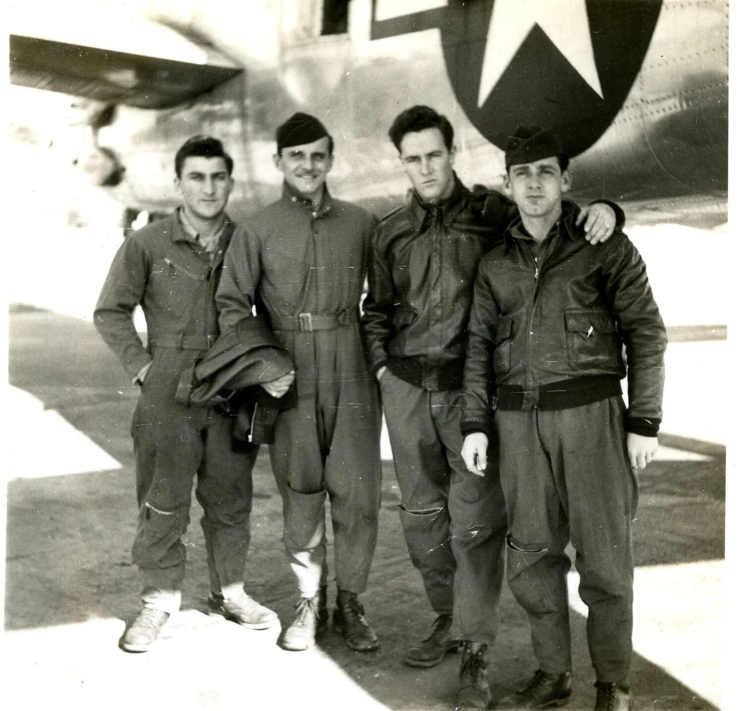 Four USAAF Airmen Posing Before Aircraft Tail Insignia, WWII-era Crew Photograph
