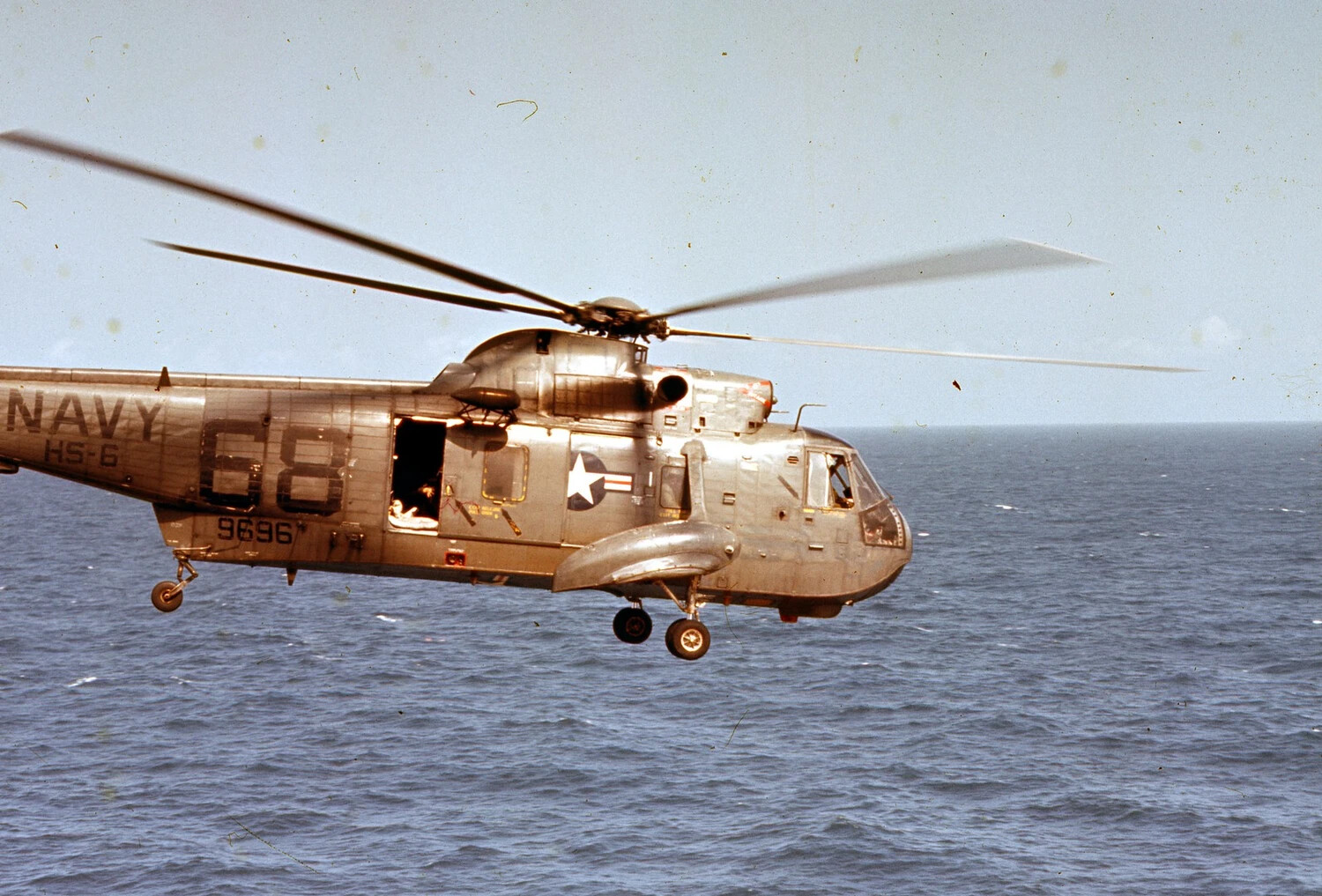U.S. Navy SH-3 Sea King Helicopter, HS-6, Side Number 68, in Flight Over the Pacific
