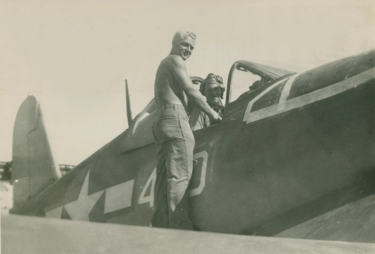 Ground Crewman Conversing with Pilot in Cockpit of U.S. Navy Fighter Aircraft, WWII Pacific Theater (McAleer Collection)