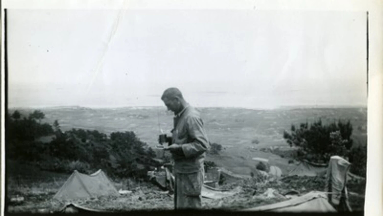 Serviceman at Hillside Observation Camp Overlooking Coastal Plain, WWII Pacific Theater