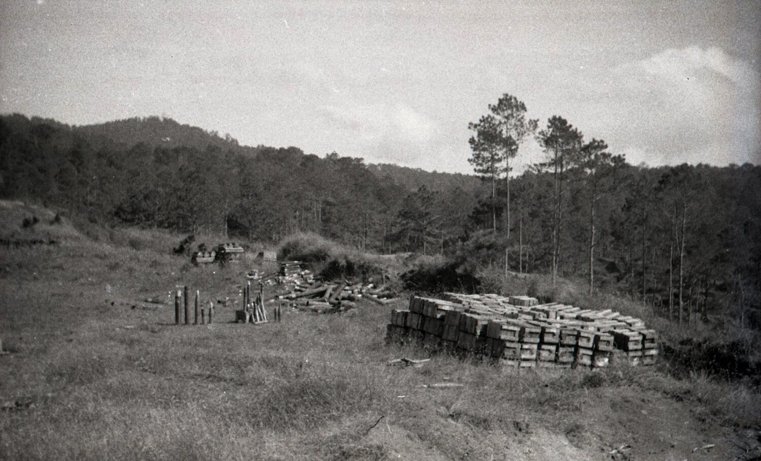 WWII Ammunition Dump with Stacked Ordnance Crates and Shell Casings, Luzon, Philippines